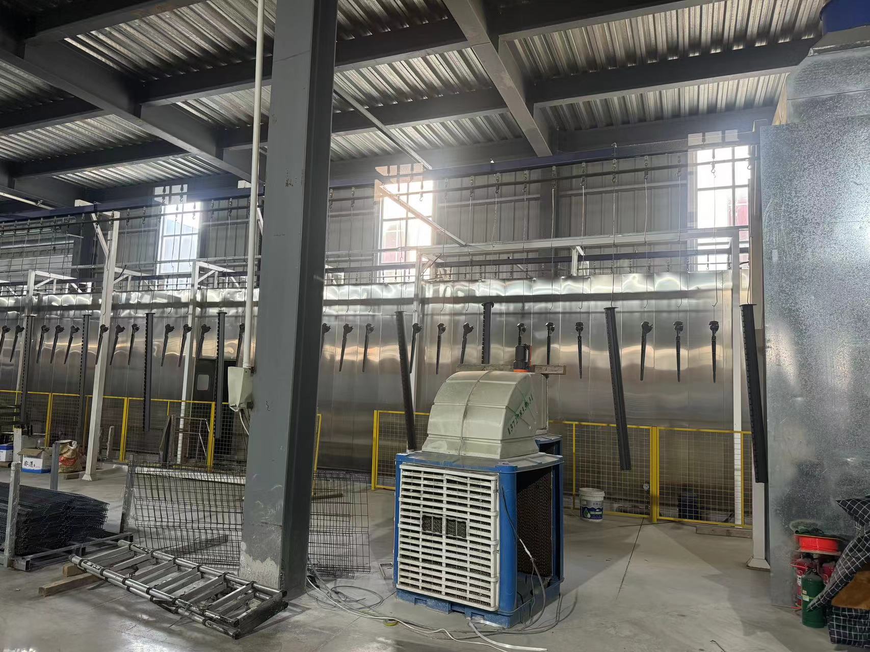 Powder coating line for fence panels