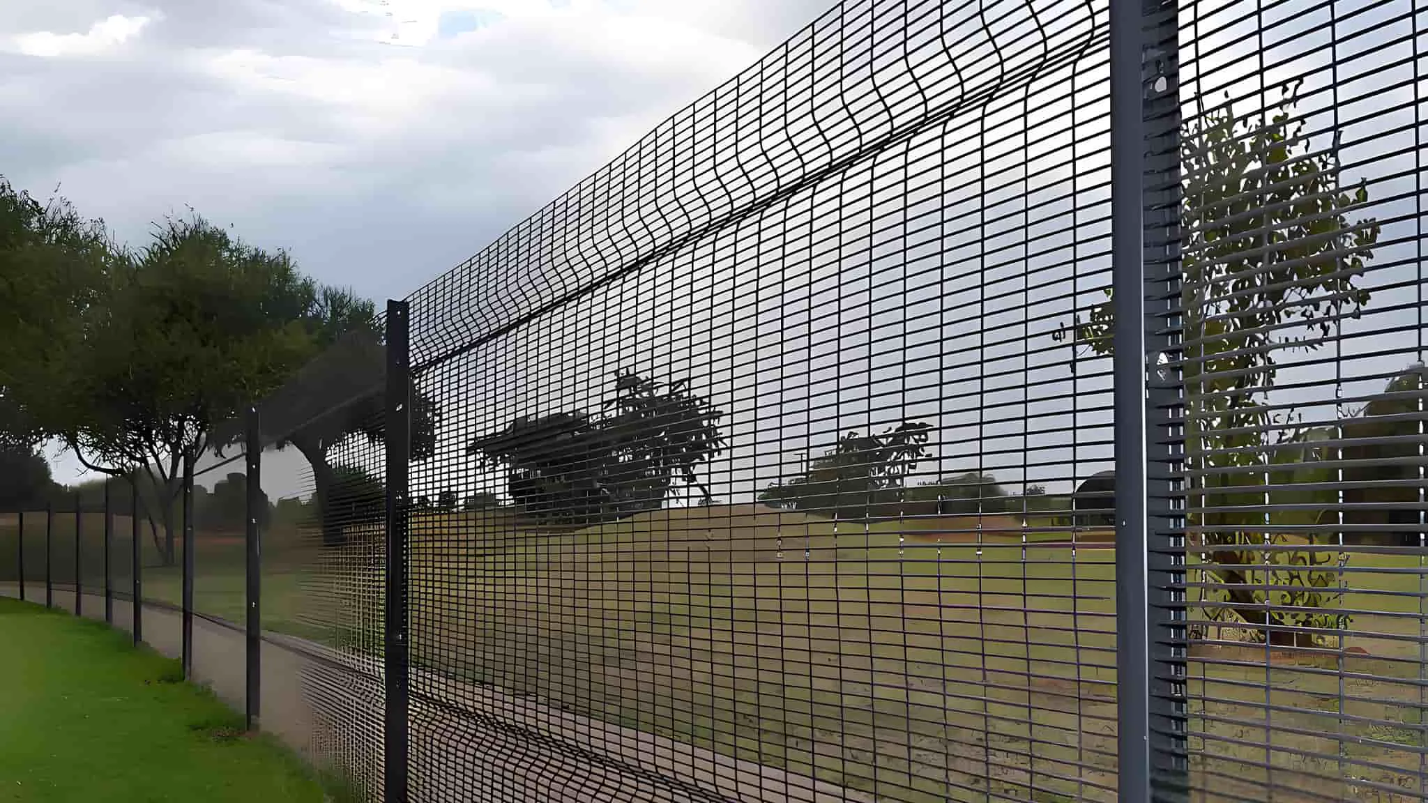 Tall 358 security fence with outward cranked anti-climb top extension