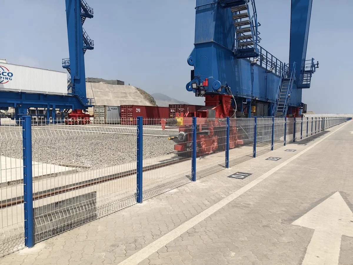 Blue-post 3D V-mesh security fence along the rail yard at Chancay Port, Peru