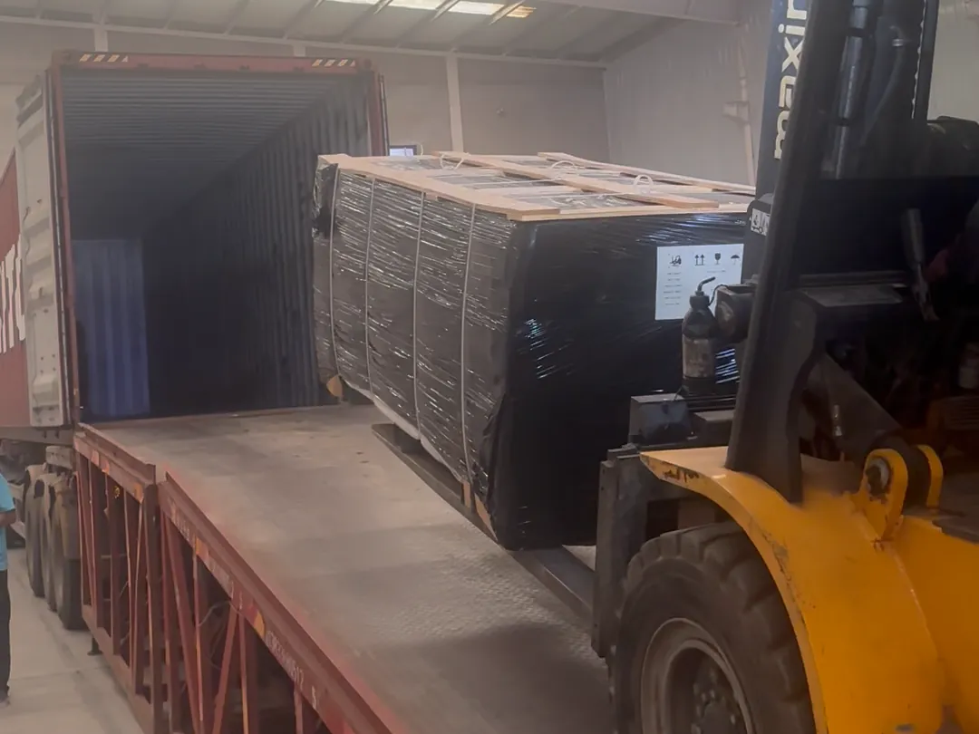 Fence panels wrapped and loaded into a shipping container at the Command factory